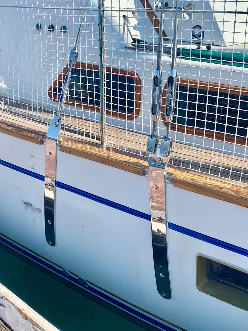 Slide: The Image of Close-up of 1977 Aleutian 51 yacht railing with metal fittings and wooden trim. - 9