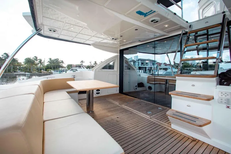 Slide: The Image of Luxurious 2015 Absolute 56 FLY yacht with spacious deck and elegant seating area. - 13
