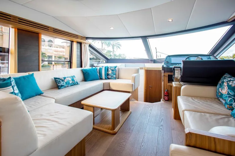 Slide: The Image of Luxurious interior of 2015 Absolute 56 FLY yacht with elegant seating and panoramic windows. - 4