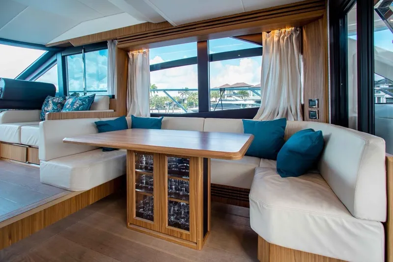 Slide: The Image of Luxurious interior of 2015 Absolute 56 FLY yacht with elegant seating and wooden table. - 6