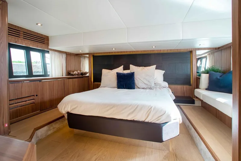 Slide: The Image of Luxurious bedroom interior of 2015 Absolute 56 FLY yacht with modern design and cozy ambiance. - 7