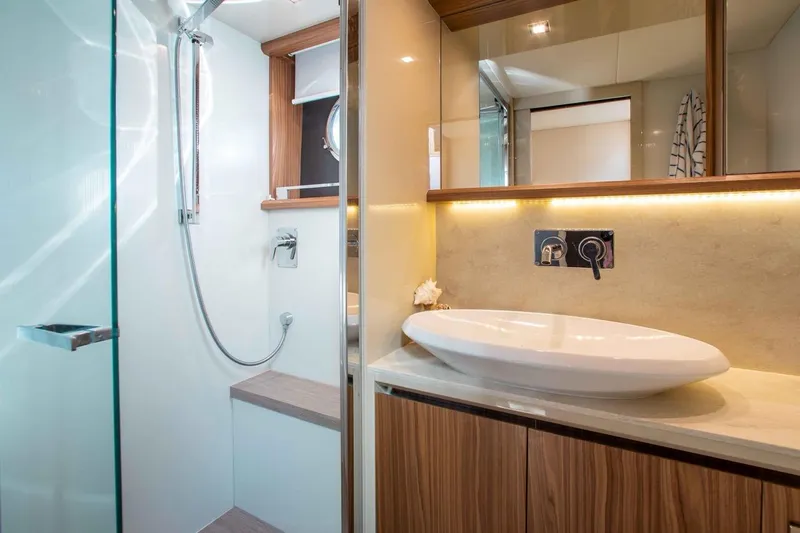 Slide: The Image of Luxurious bathroom in 2015 Absolute 56 FLY yacht with modern fixtures and elegant design. - 9