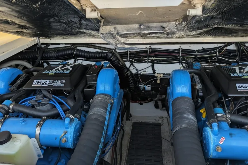 Slide: The Image of Engine compartment of a 1995 Tiara Yachts 3100 Open, featuring twin Crusader 454XL engines. - 43