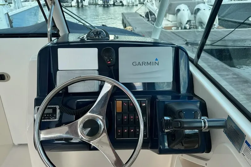 Slide: The Image of Helm of 2016 Pursuit DC 265 Dual Console with Garmin navigation system. - 8