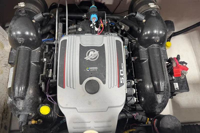 Slide: The Image of 2012 Rinker Captiva 216 BR engine, featuring a MerCruiser 5.0 MPI. - 13