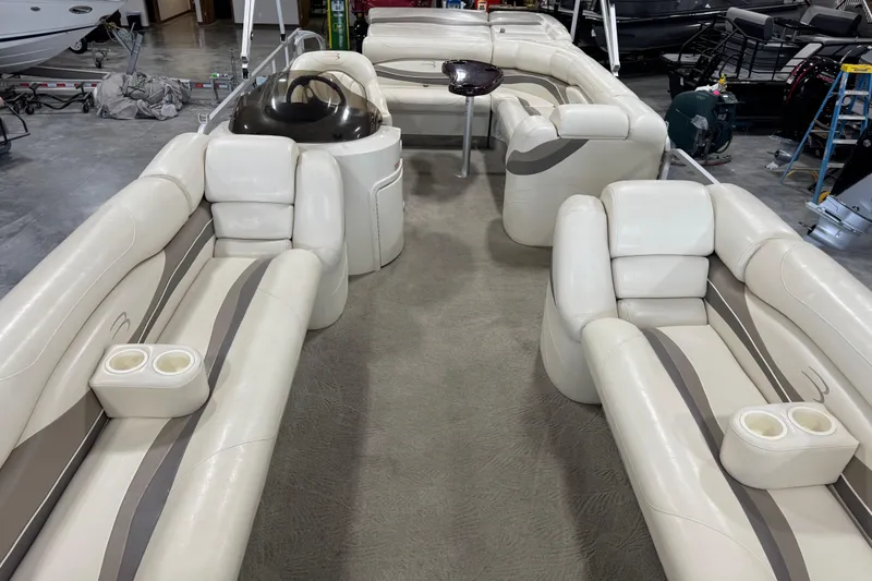 Slide: The Image of Luxurious interior of a 2006 Bennington 2575 RL I/O pontoon boat with plush seating. - 8