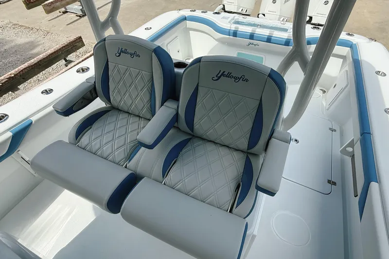 Slide: The Image of 2024 Yellowfin 34 Offshore boat cruising on a scenic waterway. - 11