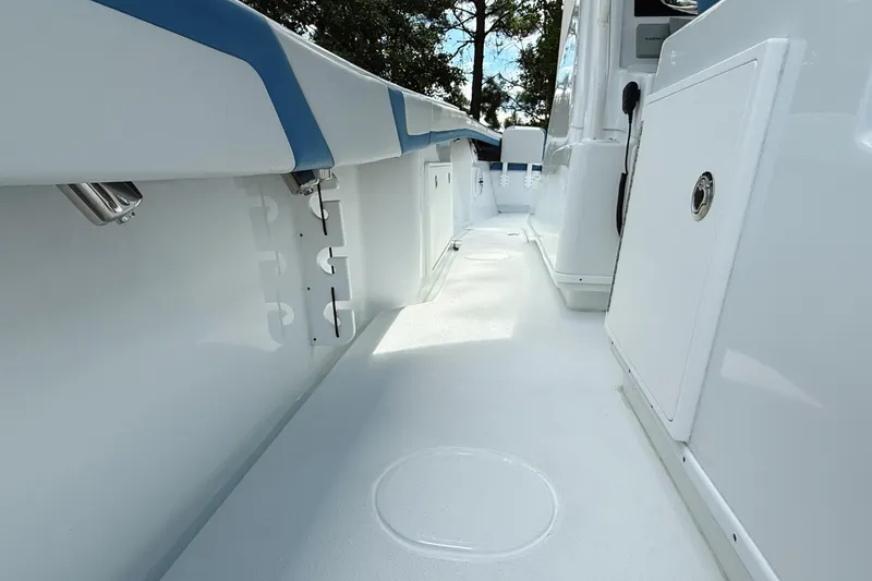 Slide: The Image of 2024 Yellowfin 34 Offshore helm with dual Garmin displays and controls. - 12