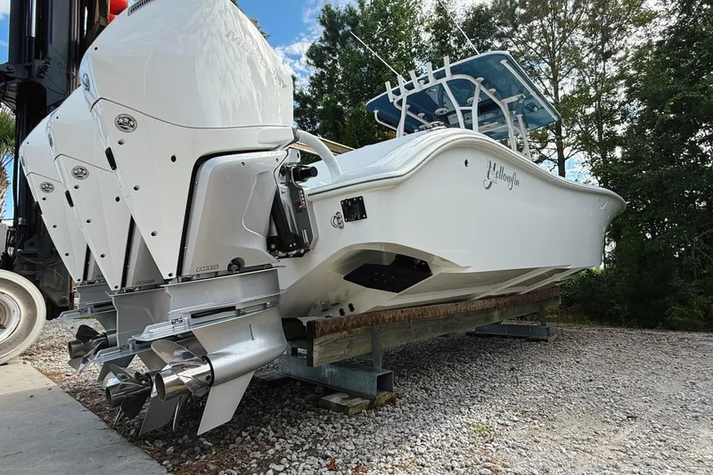 Slide: The Image of 2024 Yellowfin 34 Offshore boat interior with spacious seating and modern design. - 27