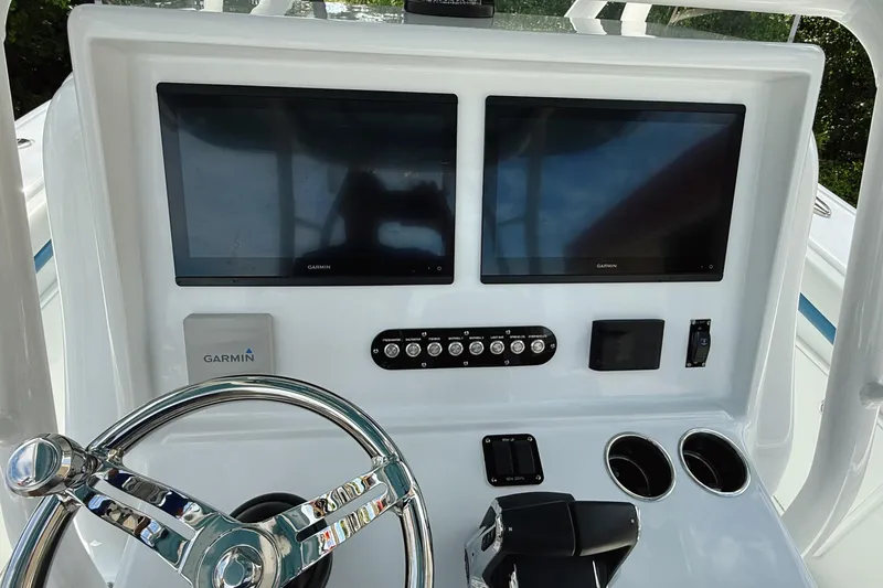 Slide: The Image of 2024 Yellowfin 34 Offshore boat docked, featuring sleek design and modern equipment. - 9