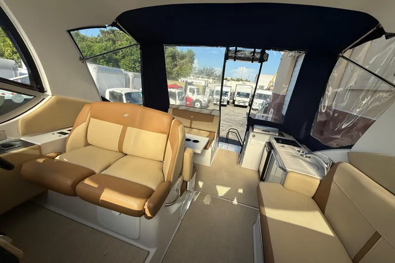 Slide: The Image of Interior of 2012 Four Winns V305 boat with seating and kitchenette. - 15