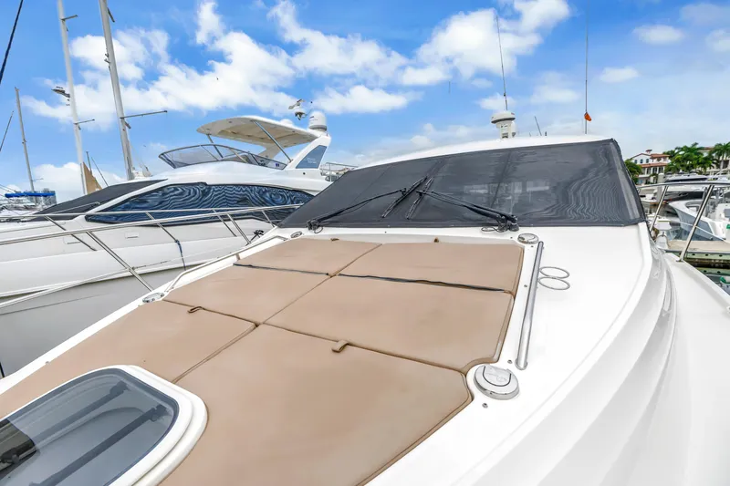 Slide: The Image of 2017 Sea Ray Sundancer 460 yacht docked, featuring sleek design and spacious deck. - 10