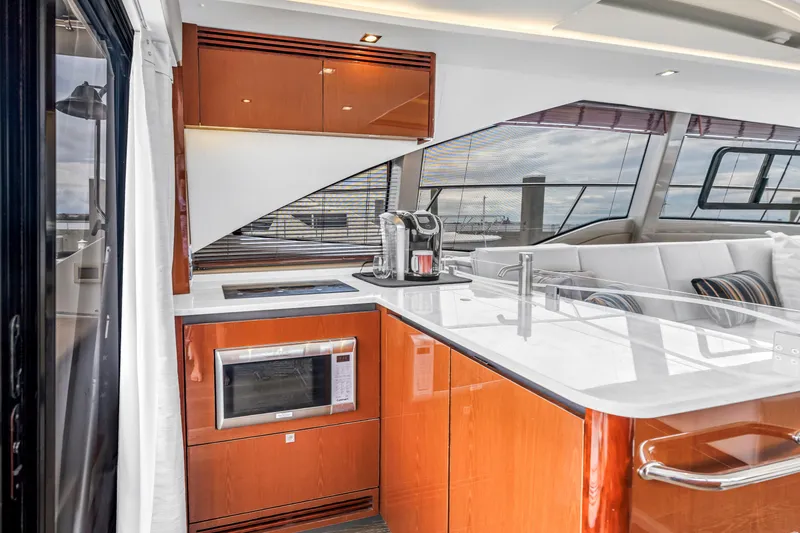 Slide: The Image of Luxurious 2017 Sea Ray Sundancer 460 yacht interior with modern kitchen and sleek design. - 26