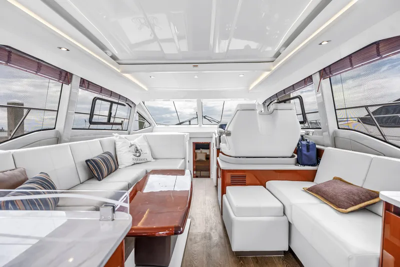 Slide: The Image of Luxurious interior of 2017 Sea Ray Sundancer 460 yacht with elegant seating and panoramic windows. - 28