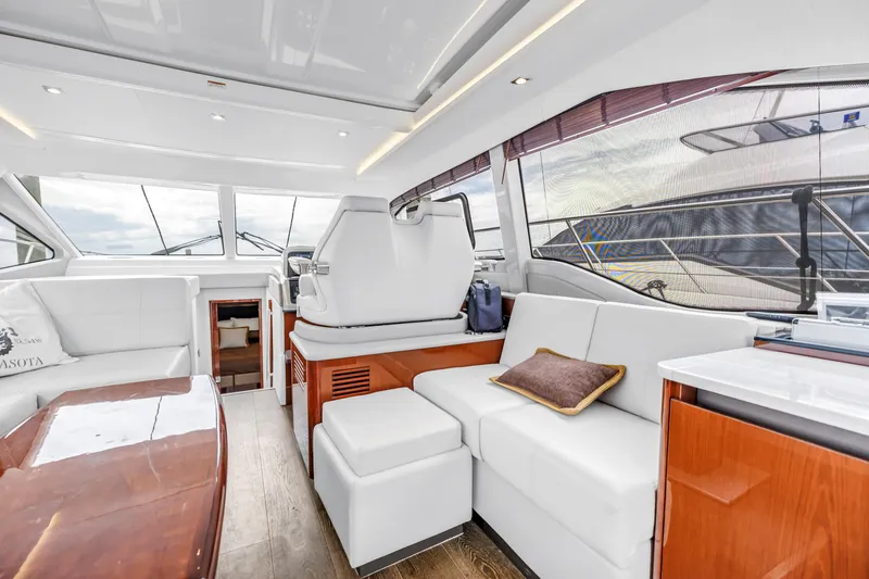Slide: The Image of Luxurious interior of 2017 Sea Ray Sundancer 460 yacht with elegant seating and wood accents. - 30