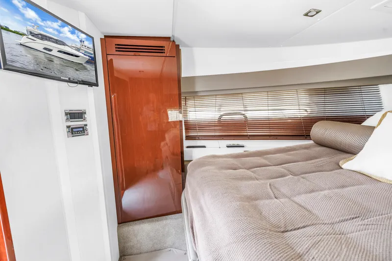 Slide: The Image of Luxurious 2017 Sea Ray Sundancer 460 yacht interior with cozy bedroom and modern amenities. - 40