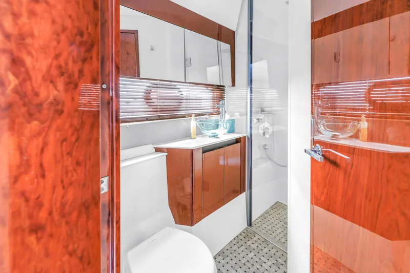 Slide: The Image of Luxurious bathroom interior of 2017 Sea Ray Sundancer 460 yacht with wood accents and modern fixtures. - 43