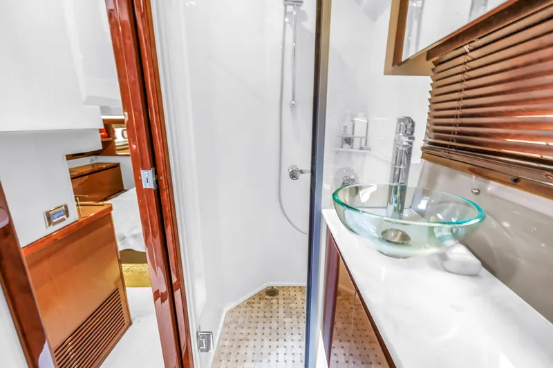 Slide: The Image of Luxurious bathroom in 2017 Sea Ray Sundancer 460 yacht with glass sink and shower. - 47