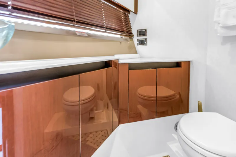 Slide: The Image of Luxurious bathroom interior of 2017 Sea Ray Sundancer 460 yacht with wooden cabinets. - 48