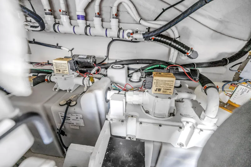 Slide: The Image of Engine room of 2017 Sea Ray Sundancer 460 with visible mechanical components. - 49