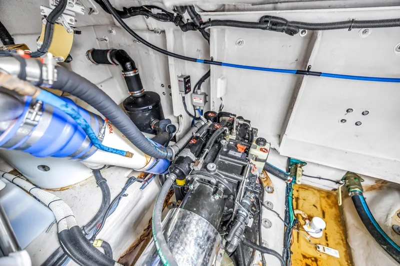 Slide: The Image of Engine room of 2017 Sea Ray Sundancer 460, showcasing mechanical components and wiring. - 51