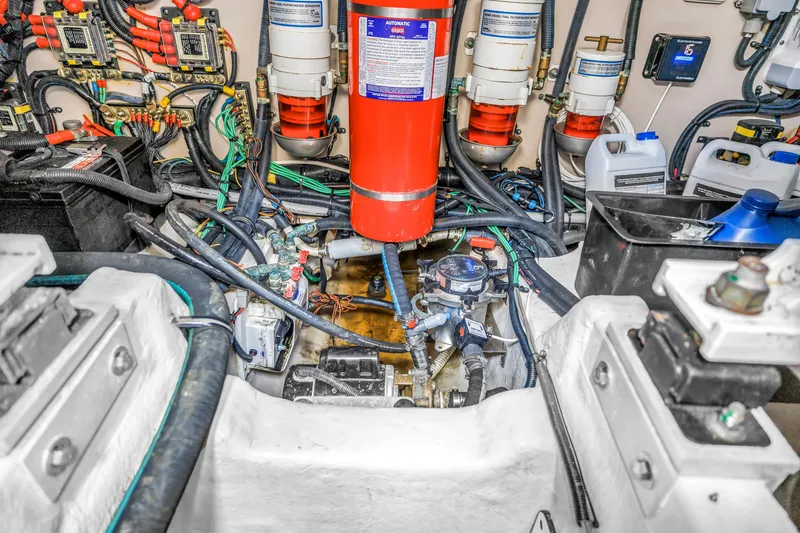 Slide: The Image of Engine room of 2017 Sea Ray Sundancer 460 with complex wiring and equipment. - 52