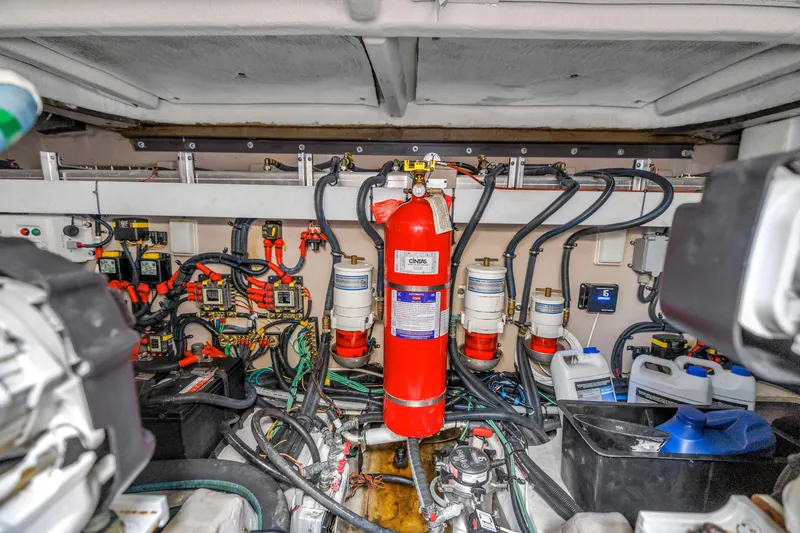 Slide: The Image of Engine room of 2017 Sea Ray Sundancer 460 with fire extinguisher and wiring systems. - 56