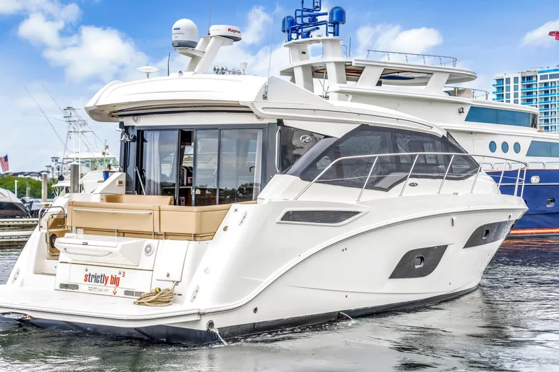Slide: The Image of 2017 Sea Ray Sundancer 460 yacht docked at marina, featuring sleek design and modern amenities. - 6