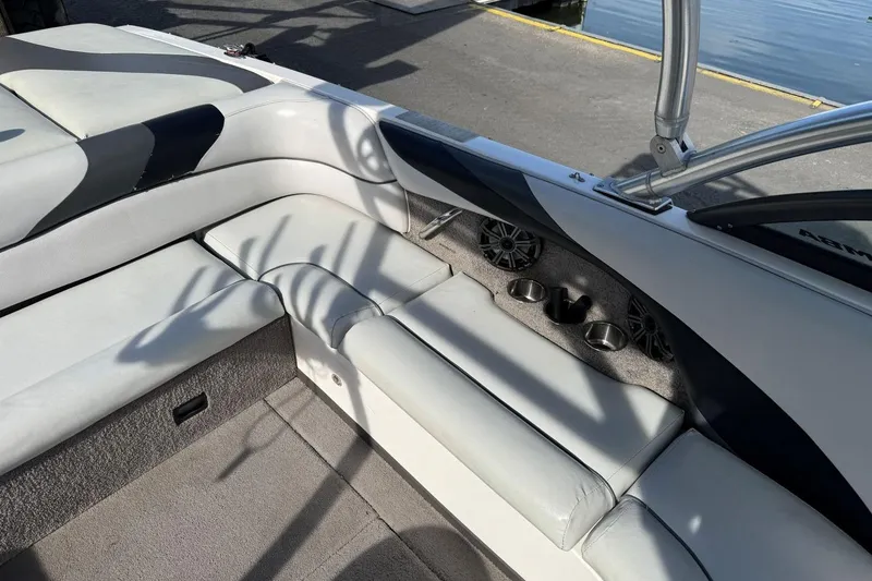 Slide: The Image of 2008 Moomba Mobius LSV boat interior with cushioned seating and cup holders. - 13