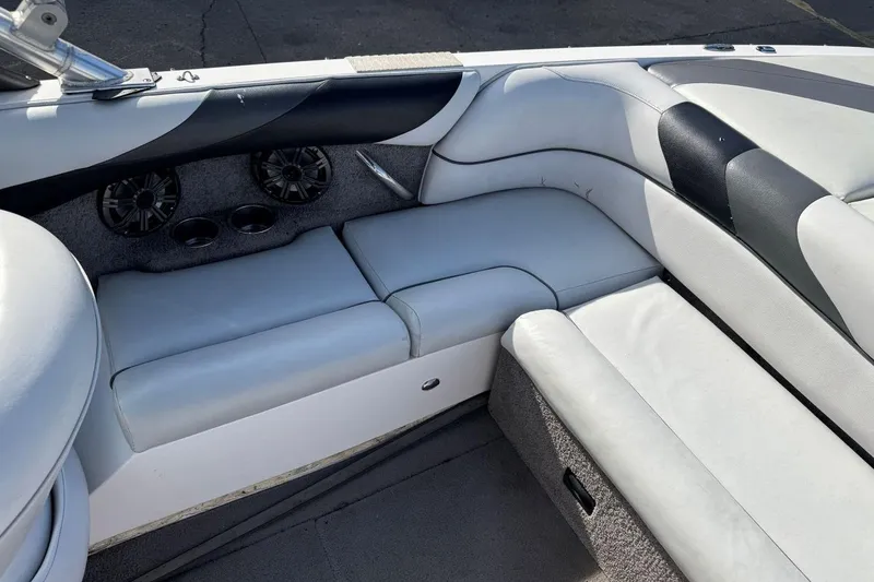 Slide: The Image of 2008 Moomba Mobius LSV boat interior with white leather seating and built-in speakers. - 15