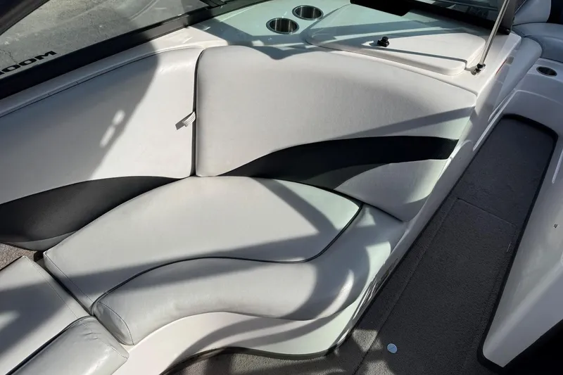 Slide: The Image of 2008 Moomba Mobius LSV interior with gray seating and cup holders. - 21