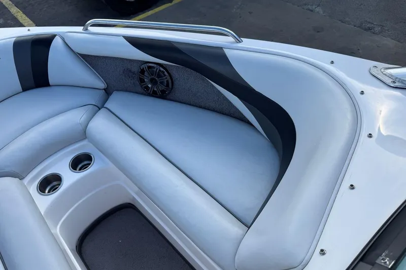 Slide: The Image of 2008 Moomba Mobius LSV boat interior with cushioned seating and cup holders. - 24