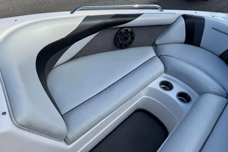 Slide: The Image of 2008 Moomba Mobius LSV boat interior with cushioned seating and cup holders. - 25