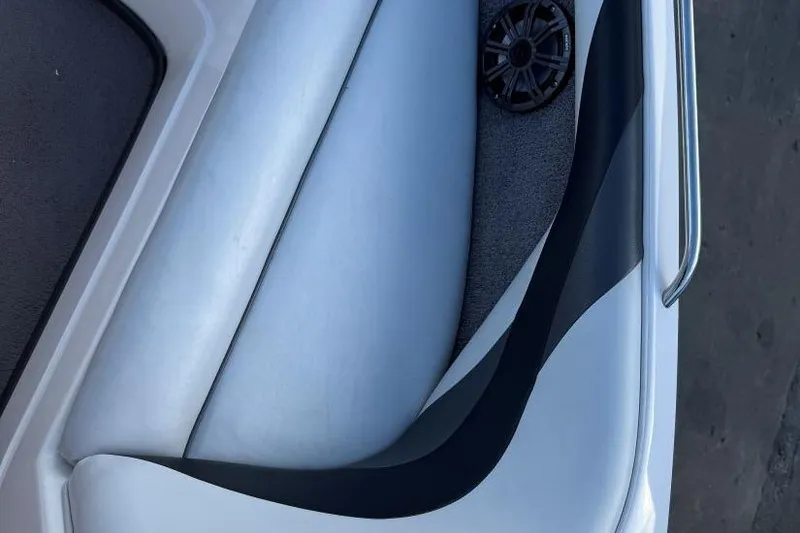 Slide: The Image of 2008 Moomba Mobius LSV boat interior with white seating and speaker detail. - 26