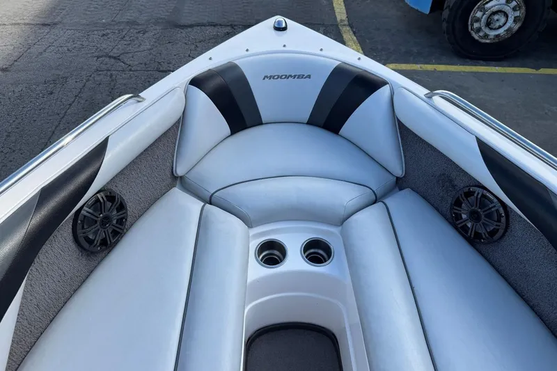 Slide: The Image of 2008 Moomba Mobius LSV boat interior with white seating, cup holders, and speakers. - 27