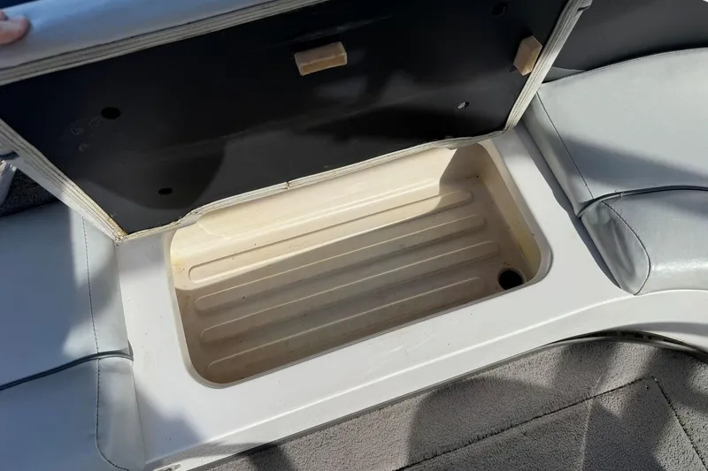 Slide: The Image of Open storage compartment in 2008 Moomba Mobius LSV boat seat. - 29