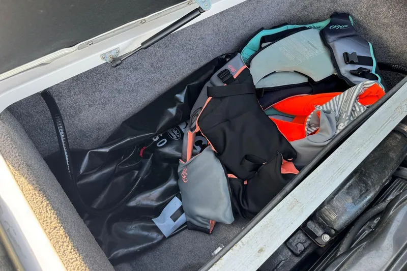 Slide: The Image of Storage compartment in a 2008 Moomba Mobius LSV boat with life jackets and gear. - 37