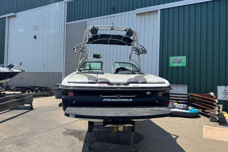 Slide: The Image of 2008 Moomba Mobius LSV boat parked outside a warehouse. - 4
