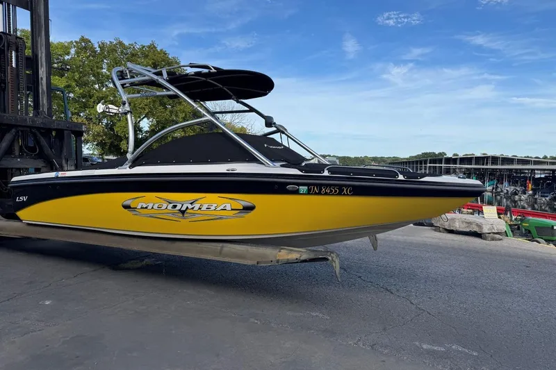 Slide: The Image of 2008 Moomba Mobius LSV boat with yellow and black design on a forklift. - 42