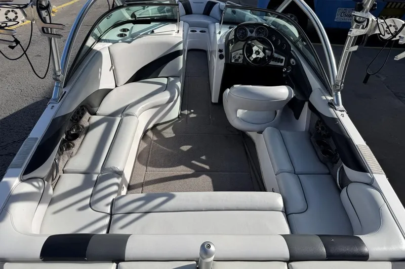 Slide: The Image of 2008 Moomba Mobius LSV boat interior with white seating and steering console. - 9