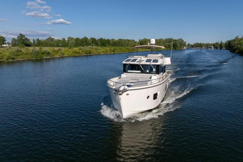 Slide: The Image of 2018 Cranchi Eco Trawler 53 Long Distance cruising on a serene river. - 0