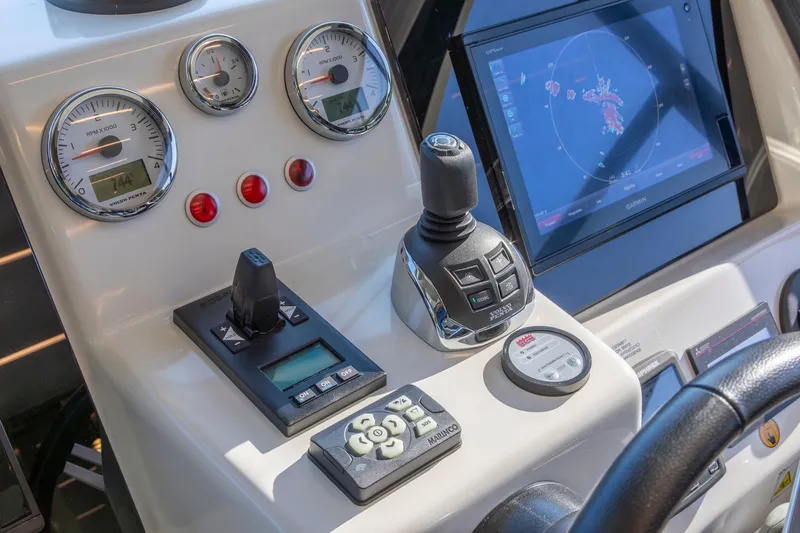 Slide: The Image of Control panel of 2018 Cranchi Eco Trawler 53 Long Distance with navigation and engine controls. - 108