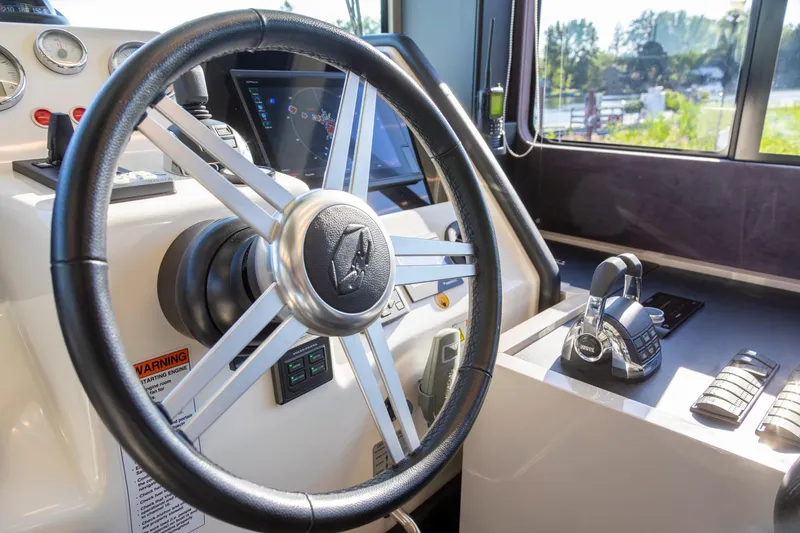 Slide: The Image of Steering wheel and controls of 2018 Cranchi Eco Trawler 53 Long Distance yacht. - 111