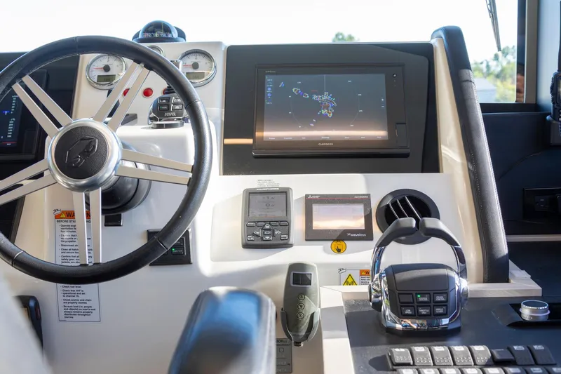 Slide: The Image of Cockpit of 2018 Cranchi Eco Trawler 53 Long Distance with navigation controls. - 115