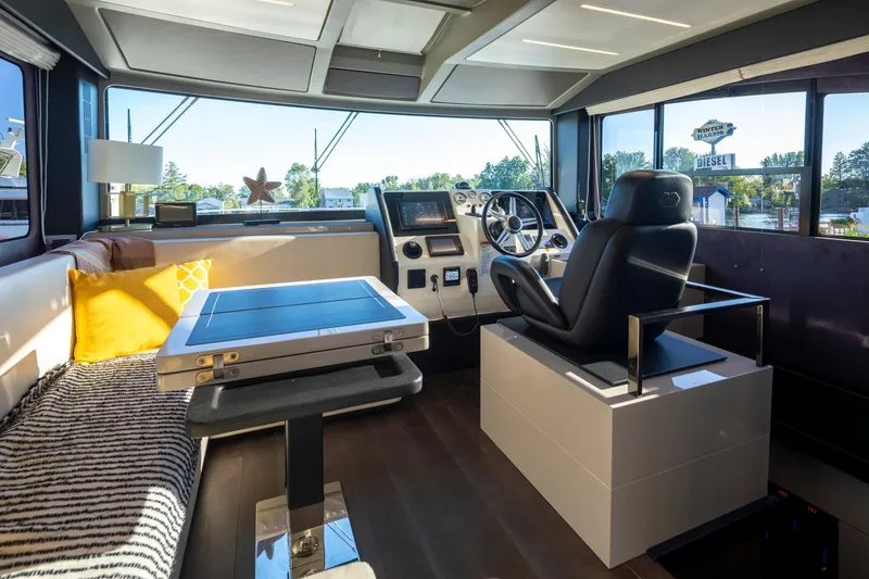 Slide: The Image of Interior of 2018 Cranchi Eco Trawler 53 Long Distance, featuring helm and seating area. - 116