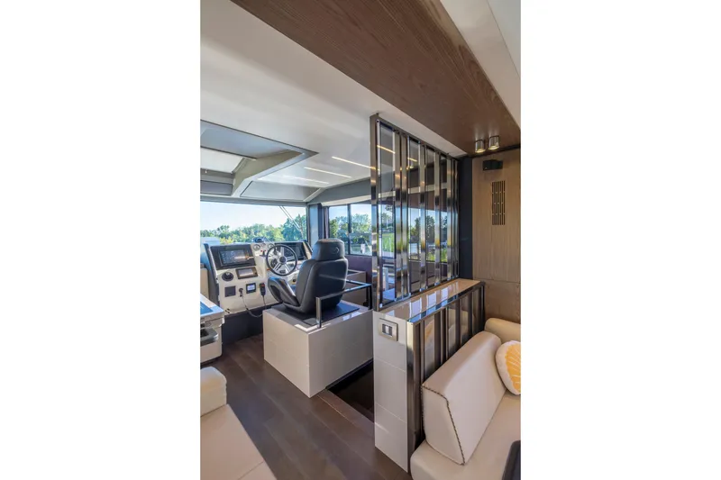 Slide: The Image of 2018 Cranchi Eco Trawler 53 Long Distance interior with modern helm and seating area. - 126