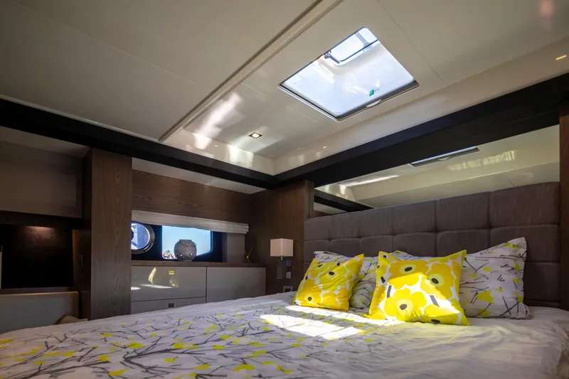 Slide: The Image of Luxurious bedroom interior of 2018 Cranchi Eco Trawler 53, featuring skylight and vibrant decor. - 131