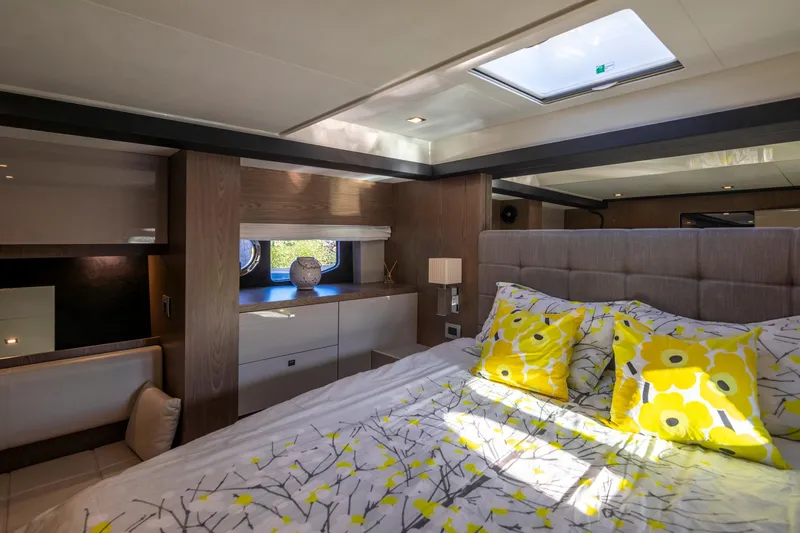 Slide: The Image of Luxurious bedroom interior of 2018 Cranchi Eco Trawler 53, featuring bright floral bedding. - 132