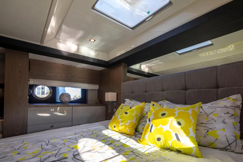 Slide: The Image of Luxurious bedroom interior of 2018 Cranchi Eco Trawler 53, featuring skylights and vibrant decor. - 133