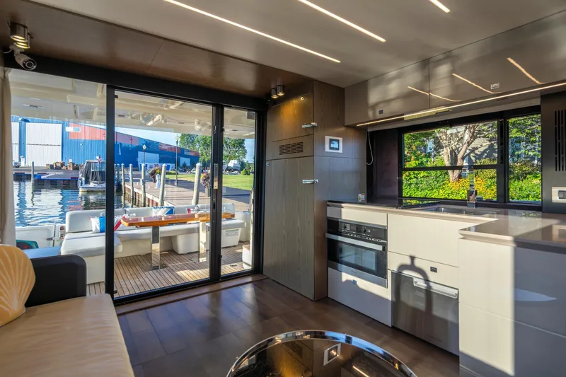 Slide: The Image of Luxurious interior of 2018 Cranchi Eco Trawler 53 Long Distance yacht with modern kitchen and outdoor seating. - 144